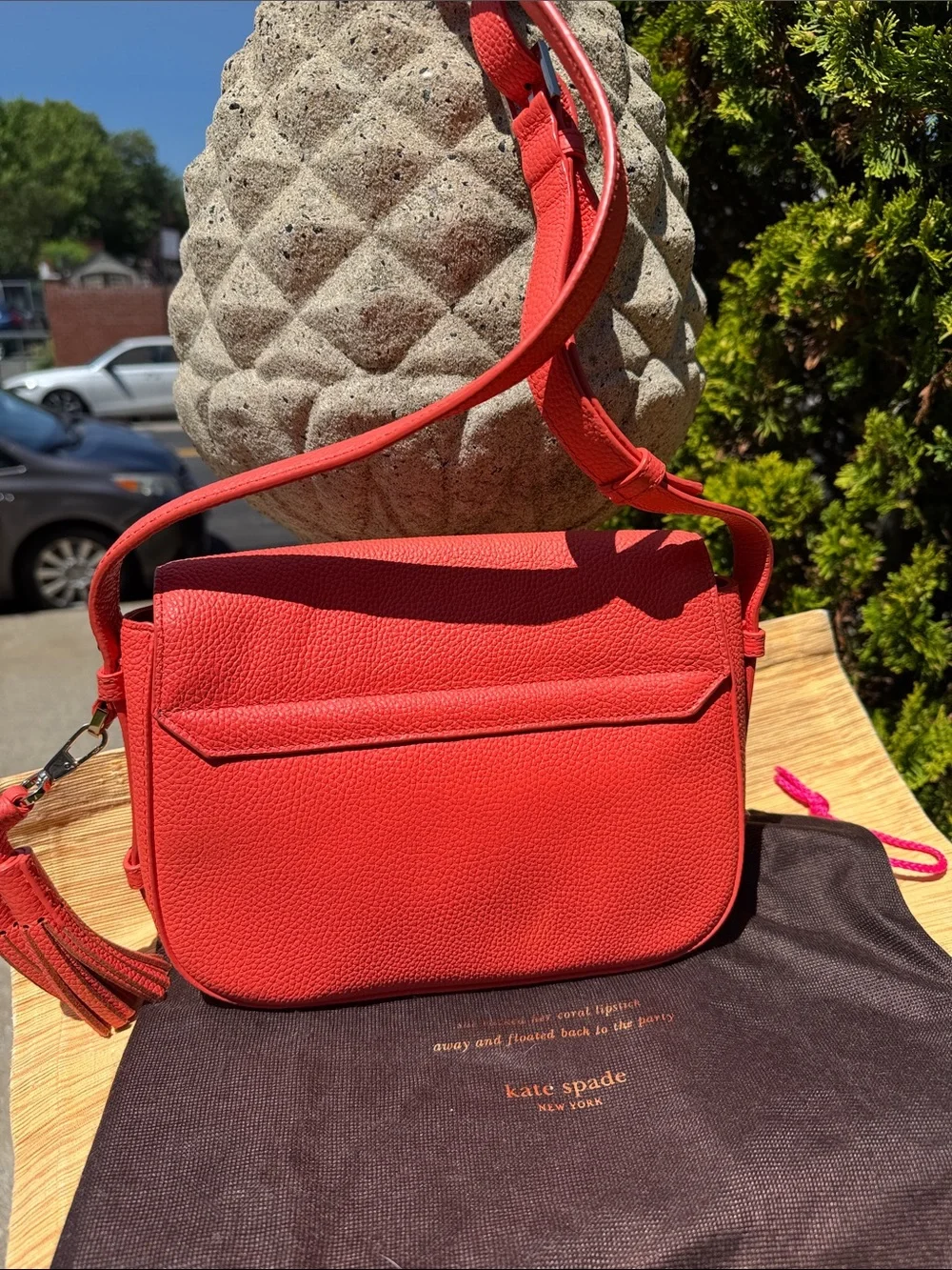 kate spade coral orange pebbled leather crossbody with tassels